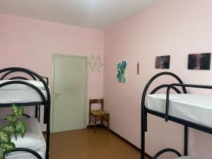Postel nebo postele na pokoji v ubytování FAMAGOSTA Home