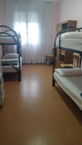 Postel nebo postele na pokoji v ubytování FAMAGOSTA Home