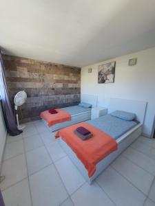 a room with two beds in a room at 5-bedroom Villa in Playa del Duque in Adeje +37 photos
