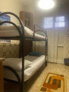 Postel nebo postele na pokoji v ubytování FAMAGOSTA Home