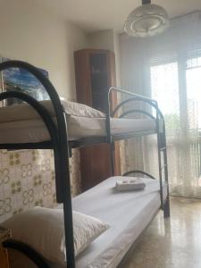 Postel nebo postele na pokoji v ubytování FAMAGOSTA Home