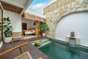 an indoor swimming pool in a villa at Exquisite 3-Bedroom Villa in Seminyak with Private Rooftop Oasis in Kerobokan