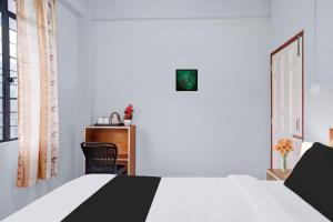Super Hotel O Lapalang Shillong客房内的一张或多张床位
