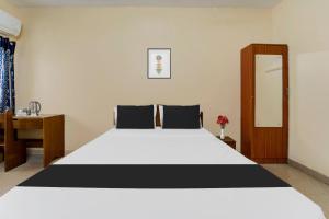 Postel nebo postele na pokoji v ubytování Super Hotel O Chinnamuthu Main Street