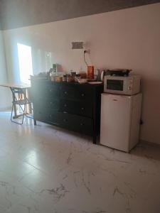Kuchyň nebo kuchyňský kout v ubytování Arneil Rooms Rome