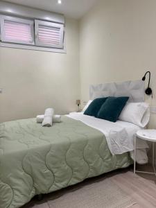 Posteľ alebo postele v izbe v ubytovaní HABITACION CENTRAL CON WIFI