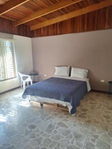 Ένα ή περισσότερα κρεβάτια σε δωμάτιο στο Carolina Hostel