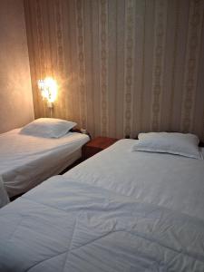 Postel nebo postele na pokoji v ubytování Twilight Inn