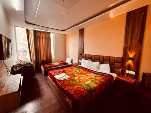 Patang Guest House客房内的一张或多张床位