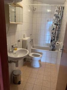 a bathroom with a toilet and a sink at Deep Blue Sea view apartments Vodice in Vodice