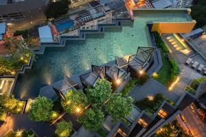 an overhead view of a swimming pool at night at EDGE Central PATTAYA SKY in Pattaya