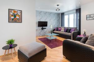 Televízia a/alebo spoločenská miestnosť v ubytovaní Neo Apartments
