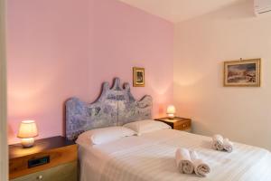 Postel nebo postele na pokoji v ubytování Hotel Pietra Verde
