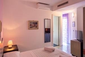 Postel nebo postele na pokoji v ubytování Hotel Pietra Verde