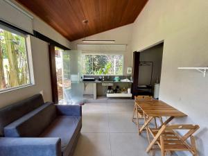 a living room with a couch and a table at Casa da 17 - Lago Sul in Brasília