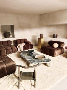 a living room with two couches and a table at Ecohotel El Agua in Arico el Nuevo +151 photos