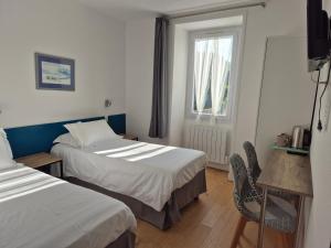 Postel nebo postele na pokoji v ubytování Hôtel Glann Ar Mor