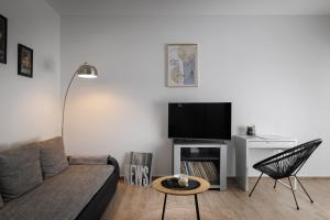 a living room with a couch and a table at Apartment Miha in Loborika
