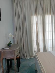 A bed or beds in a room at spyridoula studio