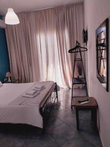 A bed or beds in a room at spyridoula studio
