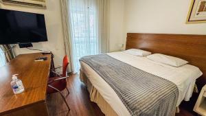 Postel nebo postele na pokoji v ubytování HOTEL PERDIZES - FLAT Executivo - 1206