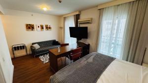 TV a/nebo společenská místnost v ubytování HOTEL PERDIZES - FLAT Executivo - 1206