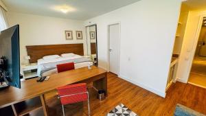Postel nebo postele na pokoji v ubytování HOTEL PERDIZES - FLAT Executivo - 1206
