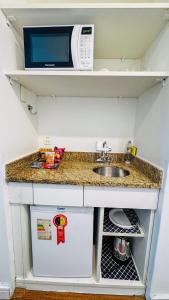 Kuchyň nebo kuchyňský kout v ubytování HOTEL PERDIZES - FLAT Executivo - 1206