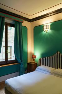 Postel nebo postele na pokoji v ubytování Hotel Hermitage