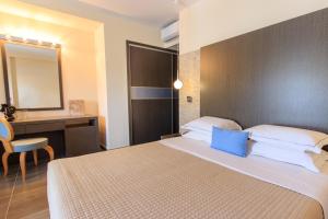 Voodi või voodid majutusasutuse ALEA Hotel & Suites toas