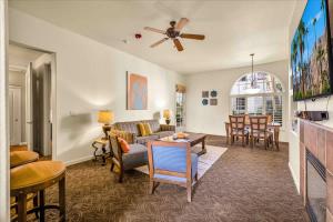 a living room with a couch and a table at Ground Floor 1BR Legacy Villa #A in La Quinta