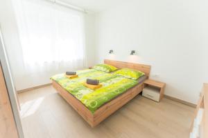 Postel nebo postele na pokoji v ubytování Apartma Gojsa