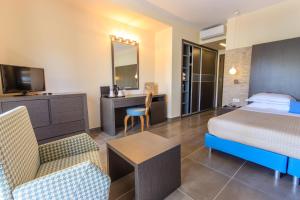 Voodi või voodid majutusasutuse ALEA Hotel & Suites toas