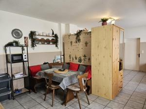 a living room with a table and a couch at 01 Manuela in Ober-Mörlen