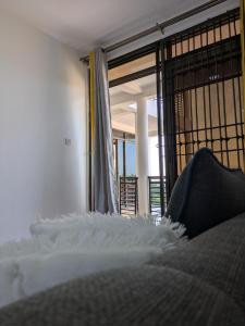 Ένα ή περισσότερα κρεβάτια σε δωμάτιο στο JK Cozy Homes