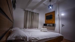 Postel nebo postele na pokoji v ubytování Mano Village