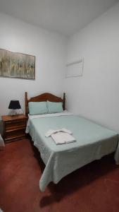 Een bed of bedden in een kamer bij Hotel Casa de Copan