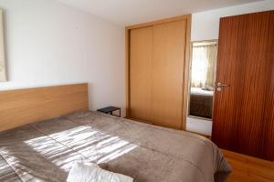 Postel nebo postele na pokoji v ubytování Cisterna Loft