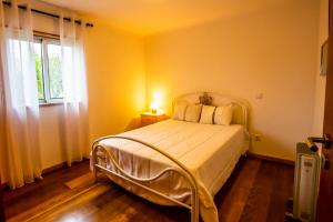 Postel nebo postele na pokoji v ubytování Casa Da Aldeia + 14 fotografií