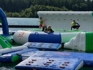 a group of people playing on an inflatable at Chalet Flufstaart in Gasselte