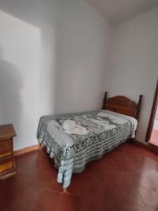 Een bed of bedden in een kamer bij Hotel Casa de Copan