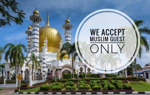 a mosque with a gold domes and a sign that says we accept muslim at Sofea Homestay Ipoh V2 in Ipoh