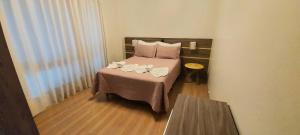 Ένα ή περισσότερα κρεβάτια σε δωμάτιο στο Apartamento Próximo estação Maria Fumaça