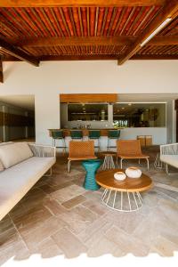 a living room with a couch and a table at Baía Branca Beach Resort in Tamandaré