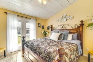 a bedroom with a large bed in a room at Grove Lake House with Boat Dock and Outdoor Spots! in Grove
