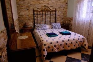 a bedroom with a bed with two pillows on it at Finca Bellas Vistas in Padul +55 photos