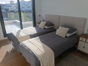 Postel nebo postele na pokoji v ubytování 321 - Luxury Penthouse with amazing views + 15 fotografií