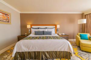 Postel nebo postele na pokoji v ubytování Hotel Lucerna Ciudad Juarez