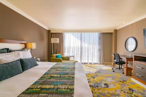 Postel nebo postele na pokoji v ubytování Hotel Lucerna Ciudad Juarez