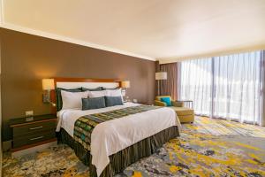 Postel nebo postele na pokoji v ubytování Hotel Lucerna Ciudad Juarez
